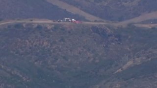 The scene of a combat jet crash north of San Diego Friday Aug. 25, 2023.