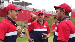 Jordan Spieth, Justin Thomas and Brooks Koepka celebrate after the United States’ victory in the Ryder Cup at Whistling Straits on September 26, 2021, in Kohler, Wisconsin.