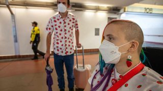 Michael Nason, 29, left, and Donna Nason, 25, right, both of Bakersfield are wearing a face mask in Union Station on Thursday, Aug. 31, 2023, in Los Angeles, CA. COVID-19 making a comeback in California.