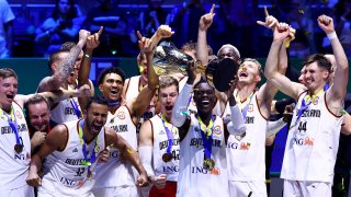 Dennis Schroder of Germany lifts the Naismith Trophy as he celebrates with teammates after the FIBA Basketball World Cup Final victory over Serbia at Mall of Asia Arena on Sept. 10, 2023 in Manila, Philippines. Germany won 83-77.