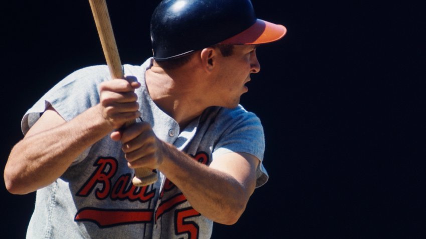 Brooks Robinson holding a bat