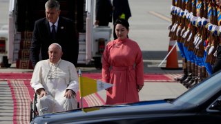 Pope Francis is received by the Foreign Minister of Mongolia, Batmunkh Battsetseg, rightas he arrives at Ulaanbaatar’s International airport Chinggis Khaan, Friday, Sept. 1, 2023. Pope Francis is traveling to Mongolia to encourage one of the world’s smallest and newest Catholic communities. It’s the first time a pope has visited the Asian country and comes at a time when the Vatican’s relations with Mongolia’s two powerful neighbors, Russia and China, are once again strained.