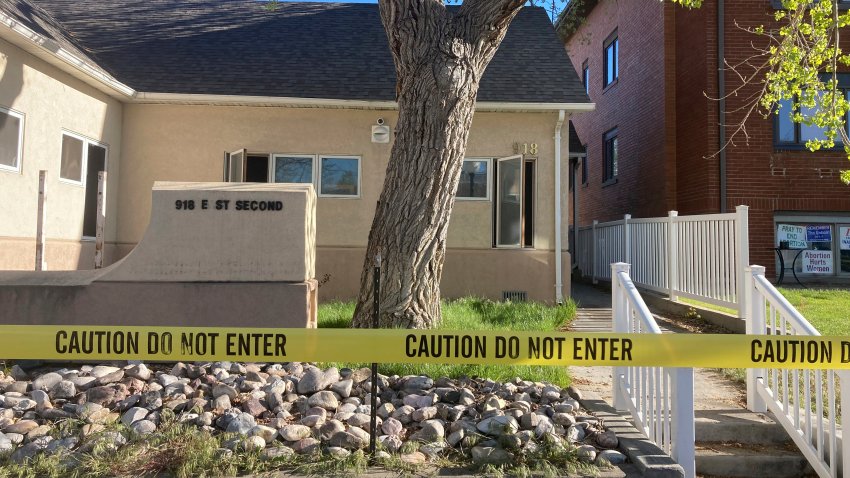 The fire-damaged Wellspring Health Access clinic is cordoned by tape, May 25, 2022, in Casper, Wyo.