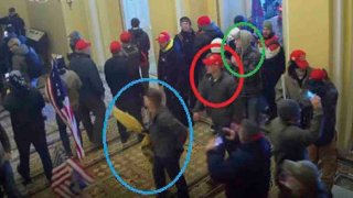 FILE - In this image from U.S. Capitol Police video, released and annotated by the Justice Department in the Statement of Facts supporting an arrest warrant, Joshua Abate, circled in green, Micah Coomer, circled in red, and Dodge Dale Hellonen, circled in blue, appear inside the U.S. Capitol on Jan. 6, 2021, in Washington.
