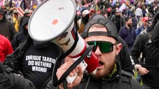 FILE - Proud Boy member Ethan Nordean walks toward the U.S. Capitol in Washington in support of President Donald Trump on Jan. 6, 2021.