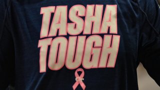 Georgia Tech players wear Tasha Tough shirts to honor former assistant coach Tasha Butts, who has breast cancer, during the ACC women's college basketball game between the North Carolina Tar Heels and the Georgia Tech Yellow Jackets Jan. 23, 2022.