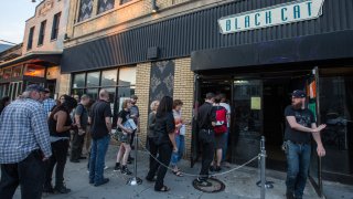 Punk rock fans line up outside the Black Cat for a fundraiser screening of the documentary, "Punk the Capital, Straight from Washington D.C." June 10, 2014.