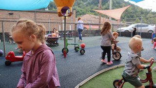 Children play on a rubber playground