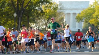 File photo, 2011: Participants in the Army Ten-Miler turn onto Independence Avenue after running past the Lincoln Memorial.