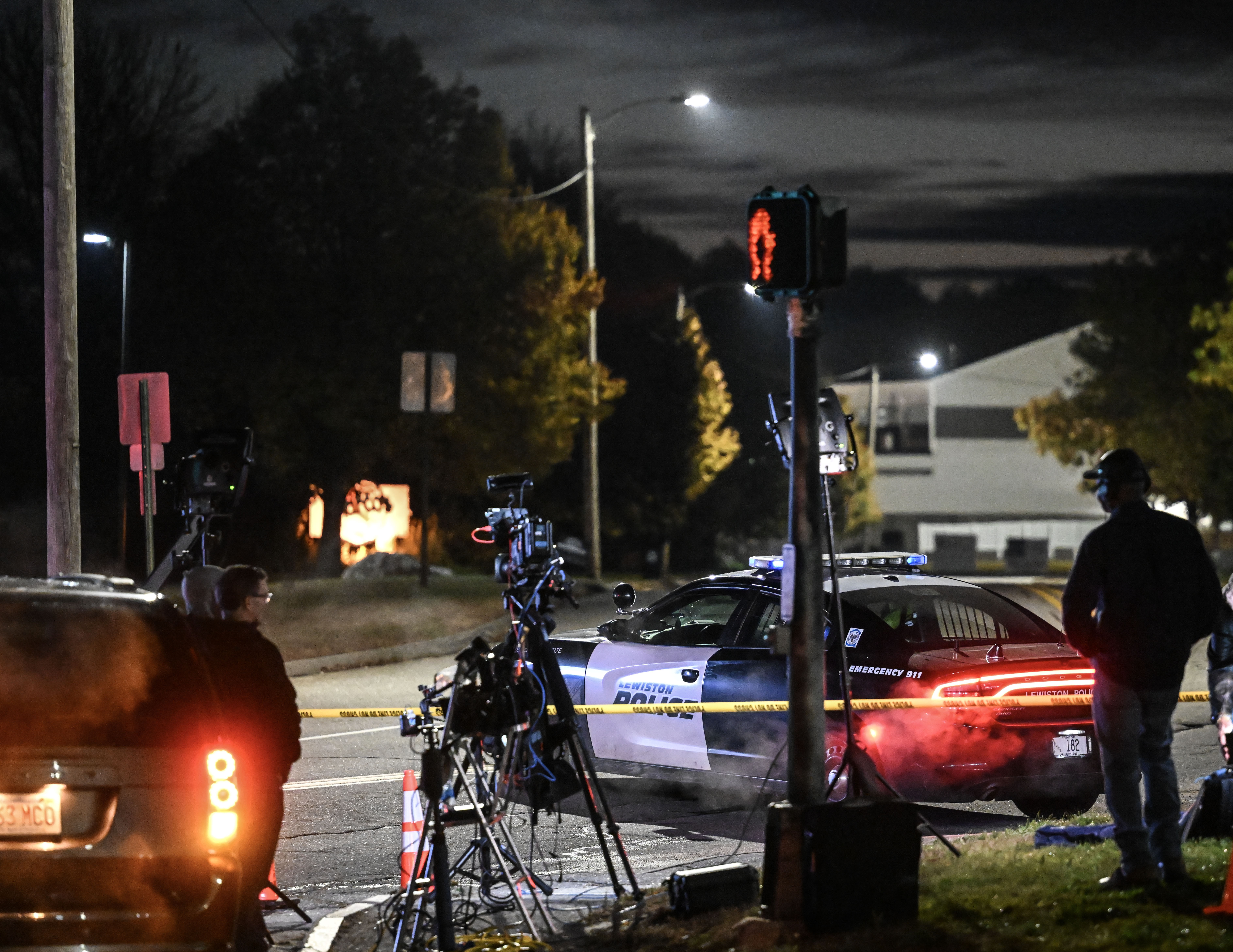 Police officers close the road as they patrol a neighborhood after issuing a warning about an ‘active shooter’ incident, October 26, 2023.