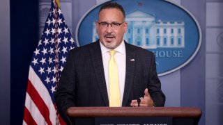 Secretary of Education Miguel Cardona answers questions during the daily briefing at the White House, Aug. 5, 2021.