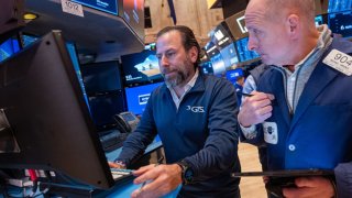 Traders work on the floor of the New York Stock Exchange (NYSE) on November 15, 2023 in New York City.