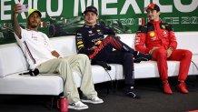 MEXICO CITY, MEXICO - OCTOBER 29: Second placed Lewis Hamilton of Great Britain and Mercedes talks a photo with Race winner Max Verstappen of the Netherlands and Oracle Red Bull Racing and Third placed Charles Leclerc of Monaco and Ferrari as they attend a press conference after the F1 Grand Prix of Mexico at Autodromo Hermanos Rodriguez on October 29, 2023 in Mexico City, Mexico. (Photo by Jared C. Tilton/Getty Images)