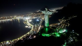 The Christ the Redeemer statue is illuminated with a welcome message for American singer Taylor Swift