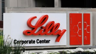FILE - A sign for Eli Lilly & Co. stands outside their corporate headquarters in Indianapolis on April 26, 2017.