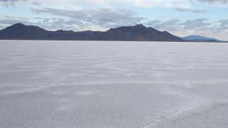 The Bonneville Salt Flats with a mountain seen in the background