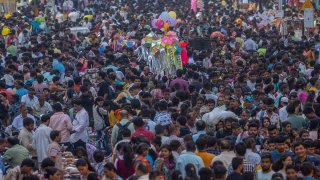 People crowd a market as they shop ahead of Diwali festival in Mumbai, India, Nov. 5, 2023.