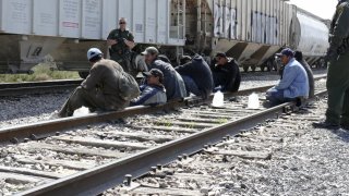 NBC NEWS — Pictured: Border Patrol Agents arrest 8 suspected illegals in Maverick County, near Eagle Pass, TX, as they try to ride a freight train into the United States from Mexico on February 27, 2007 — Photo by: Al Henkel/NBC NewsWire