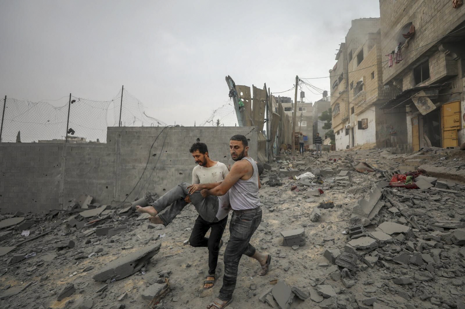 Palestinians evacuate wounded in Israeli aerial bombing on Jabaliya, near Gaza City, Wednesday, Oct.11, 2023.