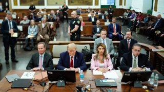 Former President Donald Trump, second from left, sits at the defense table with his attorney's Christopher Kise, left, Alina Habba, second from right, and Clifford Robert at New York Supreme Court, Thursday, Dec. 7, 2023, in New York.