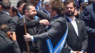 Ukrainia's President Volodymyr Zelenskyy embraces Argentina's newly sworn-in President Javier Milei