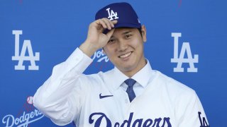 Los Angeles Dodgers’ Shohei Ohtani smiles during a baseball news conference at Dodger Stadium Thursday, Dec. 14, 2023, in Los Angeles. (AP Photo/Ashley Landis)