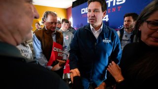 Republican presidential candidate Florida Gov. Ron DeSantis talks with audience members during a meet and greet, Friday, Nov. 3, 2023, in Denison, Iowa.