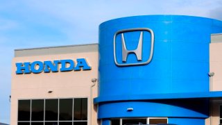 Honda auto dealership with sign and business logo above entrance, Lewiston, Idaho.