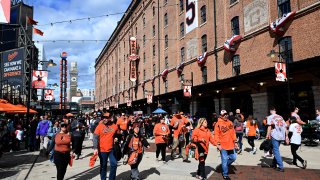 Fans walk outside the stadium before the game between the Baltimore Orioles and the Texas Rangers during Game Two of the Division Series at Camden Yards on Oct. 8, 2023 in Baltimore, Maryland.