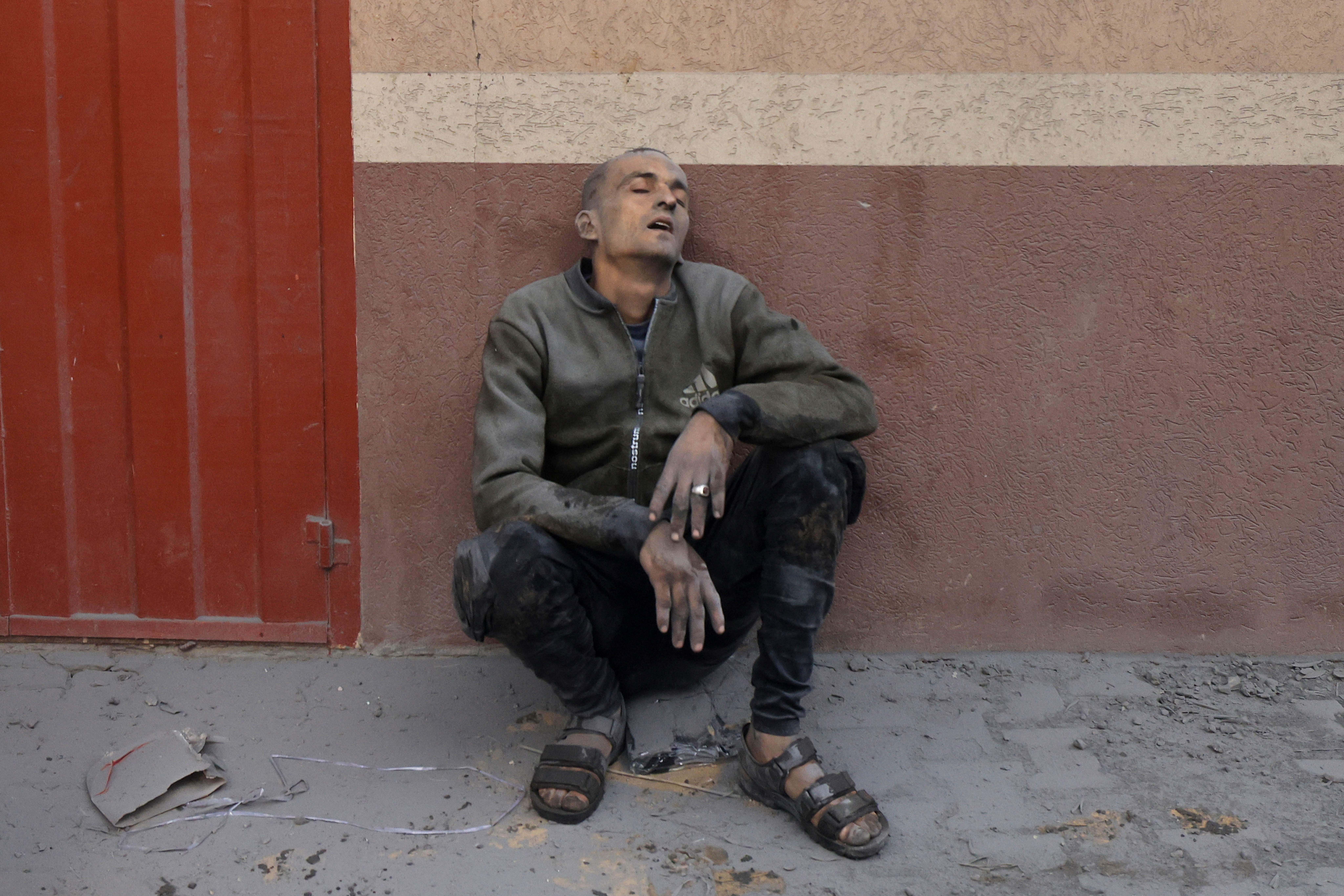 A Palestinian man reacts after in an Israeli strike on Rafah in the southern Gaza Strip on November 20, 2023, amid continuing battles between Israel and the militant group Hamas.