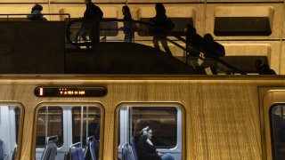 Commuters at Farragut West station in Washington, DC, US, on Wednesday, Dec. 20, 2023. Subway riders in Washington are facing a tougher commute next year with the agency that runs the public transit system serving the nation’s capital forecasting thousands of layoffs and service cuts to plug a $750 million budget hole. Photographer: Eric Lee/Bloomberg via Getty Images