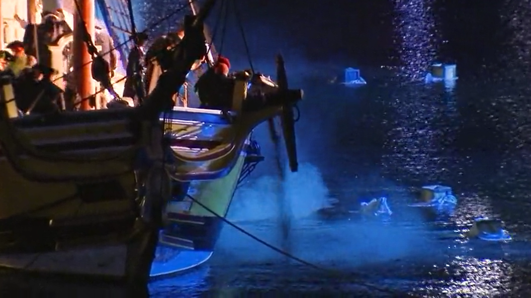 Tea being dumped in Boston Harbor on the 250th anniversary of the Boston Tea Party on Saturday, Dec. 16, 2023.