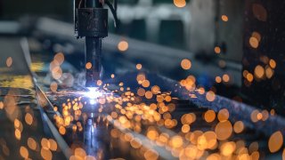 Computer Numerical Control (CNC) machine used for cutting and welding a steel structure at an industrial manufacturer.