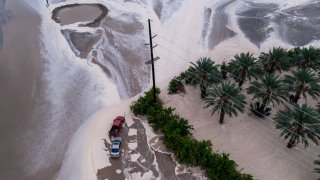 Cars stranded in a flash flood caused by a monsoonal thunderstorm on Sept. 1, 2023, in Thermal, California.