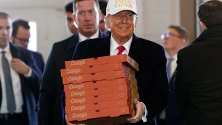 Republican presidential candidate former President Donald Trump arrives to deliver pizza to fire fighters at Waukee Fire Department