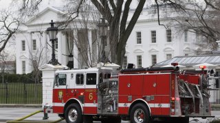 A firetruck is parked outside of the White House in Washington, Dec. 19, 2007. A fake 911 call that the White House was on fire sent emergency vehicles to the complex Monday morning. President Joe Biden and his family were at Camp David at the time.