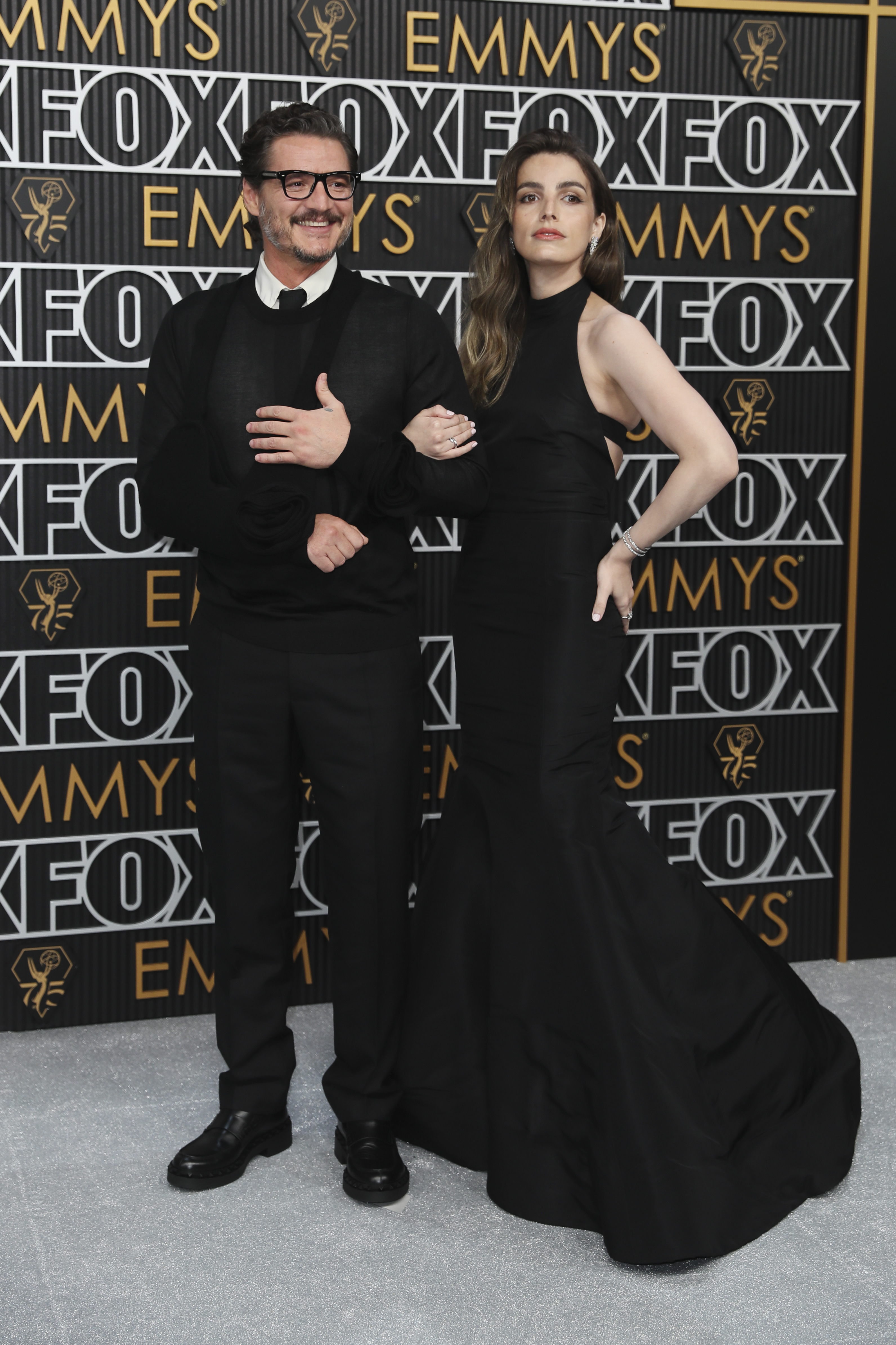 Pedro Pascal, left, and Lux Pascal pose for a Red Carpet portrait at the 75th Emmy Awards on Monday, Jan. 15, 2024 at the Peacock Theater in Los Angeles. (Photo by Danny Moloshok/Invision for the Television Academy/AP Images)