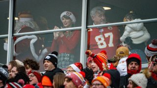 Taylor Swift watches the Kansas City Chiefs play the Las Vegas Raiders in a suite with Travis Kelce's father, Ed Kelce