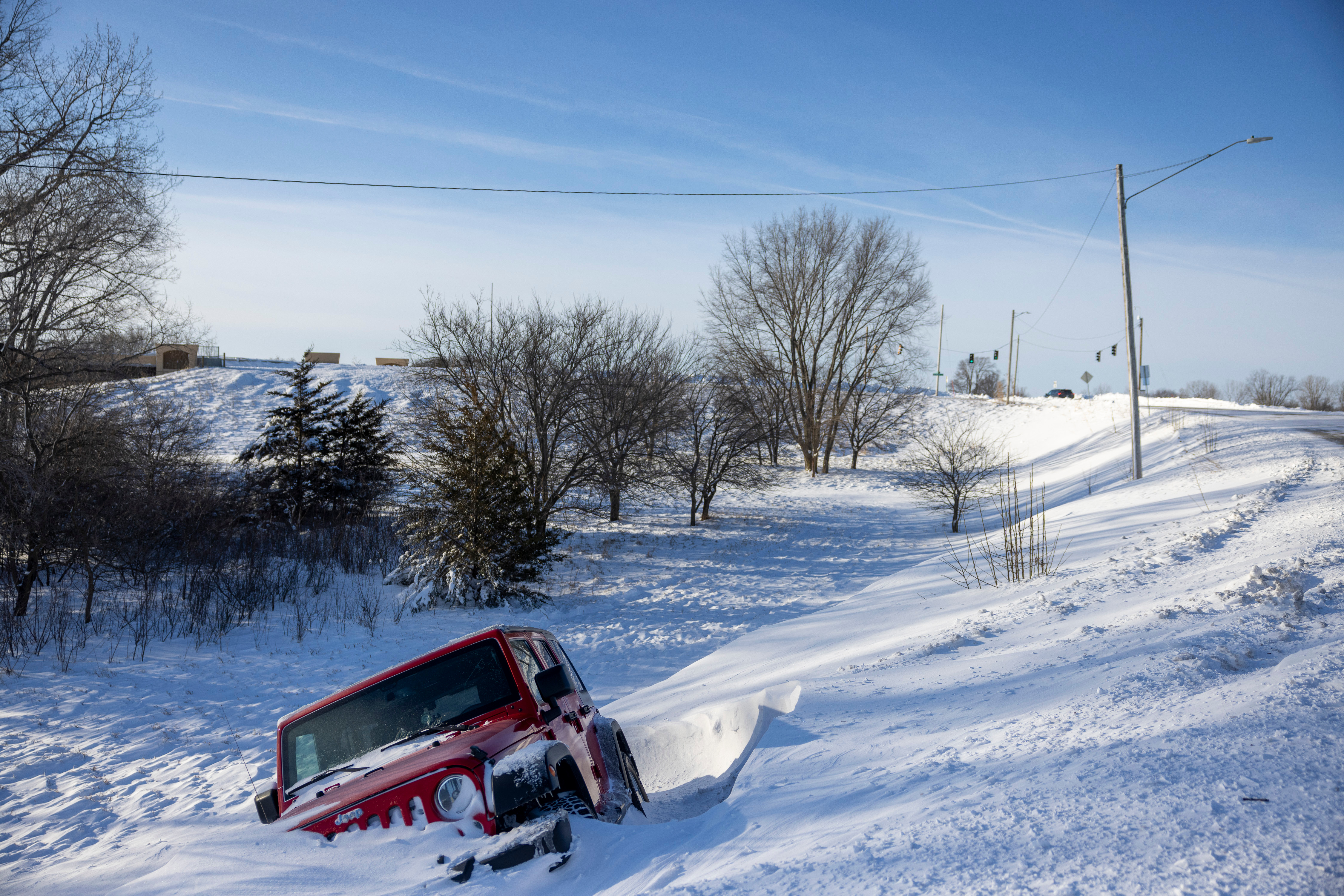 Snow, ice, wind and bitter cold pummels the northern US in dangerous winter  storm