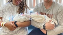 Mom, Eve, and dad, Billy, hold their New Year’s Eve and New Year's Day babies at Virtua Voorhees Hospital in New Jersey.