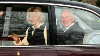 King Charles III Queen Camilla wave as they leave by car from Clarence House in London on February 6