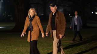President Joe Biden and First Lady Jill Biden walk on the South Lawn