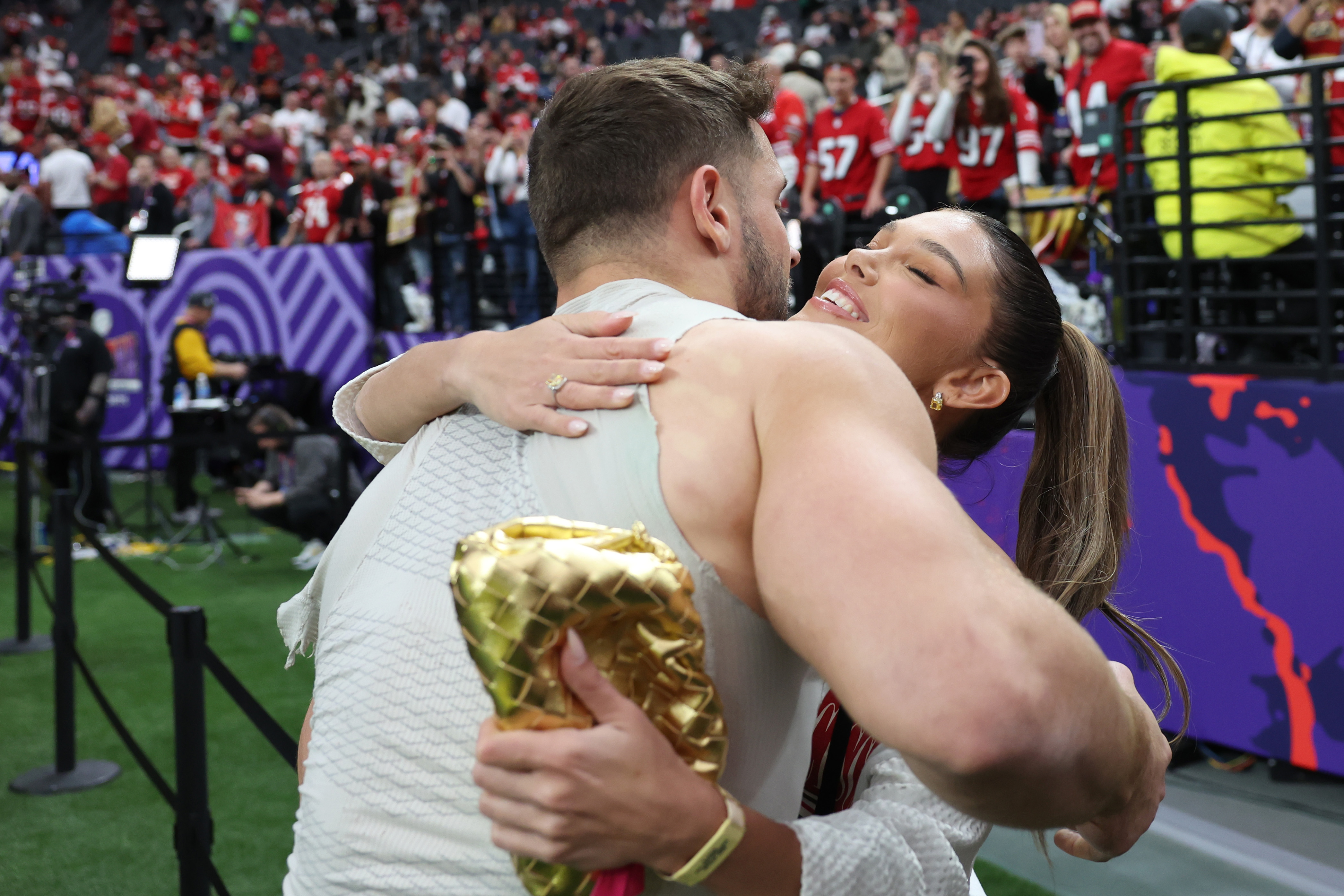 Nick Bosa #97 of the San Francisco 49ers hugs girlfriend and model Lauren Maenner before  Super Bowl LVIII against the Kansas City Chiefs at Allegiant Stadium on February 11, 2024 in Las Vegas, Nevada. <br><em>(Photo by Ezra Shaw/Getty Images)</em>