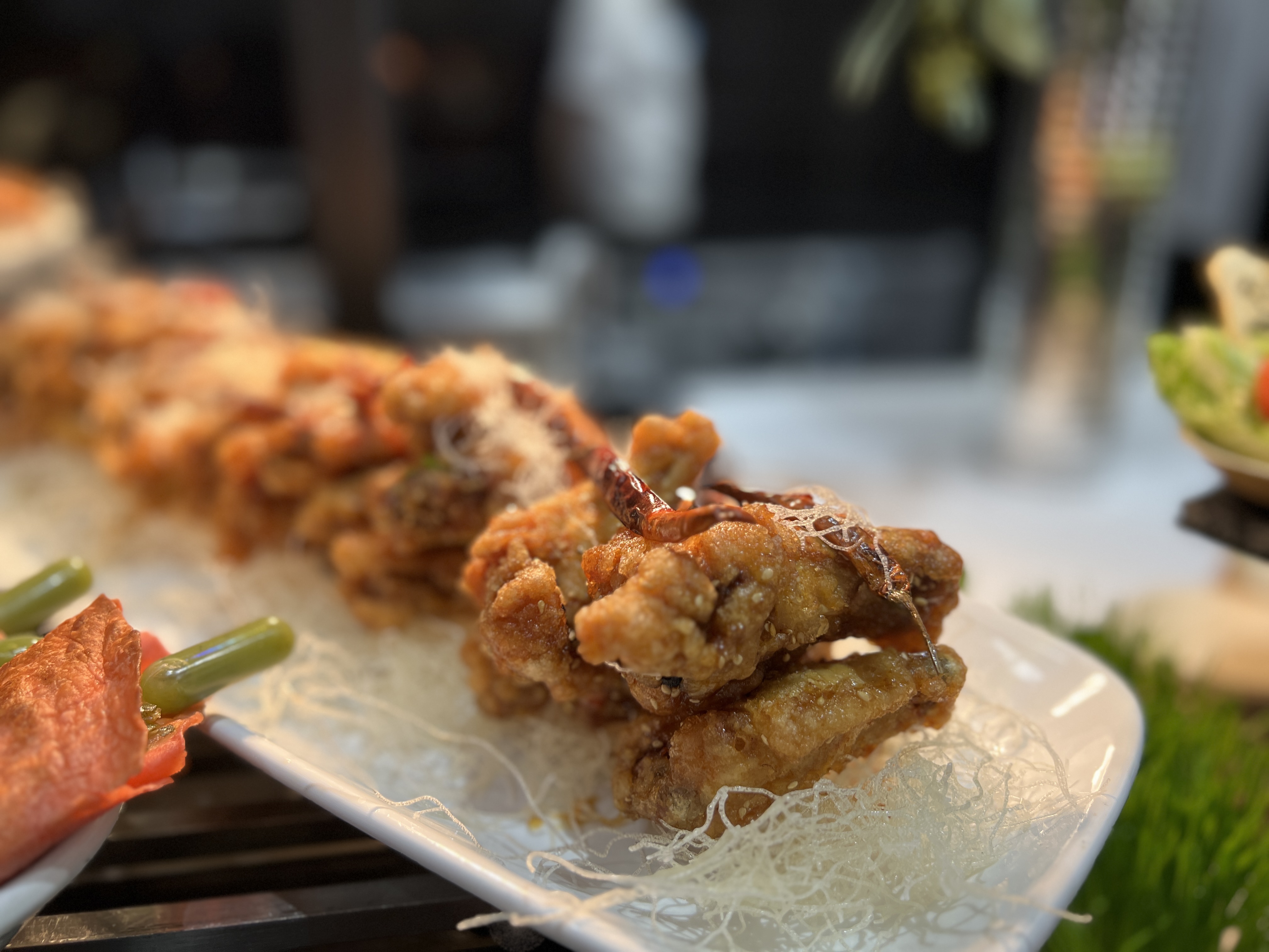 Fried chicken wings with red chili peppers for Super Bowl 58.