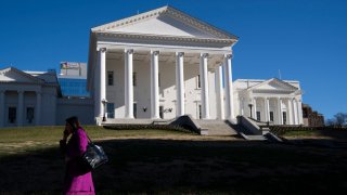 A person walks past the Virginia State Capitol building on Jan. 10, 2024 in Richmond, Virginia.