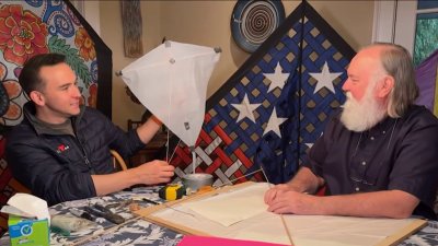 Kite master shows how to make a kite from household items
