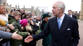 Britain's King Charles III greets people after attending the Easter Matins Service