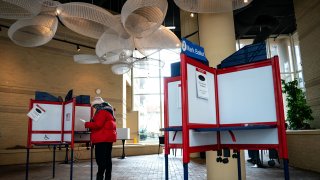Voters cast their ballots at a polling location at the Bennett Park Apartments Art Atrium on March, 5 2024