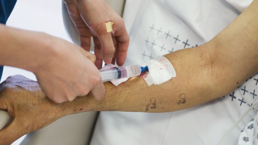 Patient having intravenous drip inserted into her arm