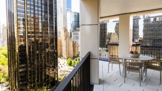 The Trump International Hotel and Tower New York building is seen from the balcony of an apartment unit in the AvalonBay Communities Inc. Park Loggia condominium at 15 West 61 Street in New York on May 15, 2019.